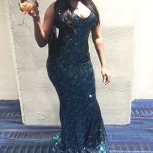 Custom made dress worn one time for a few hours. Can fit a size medium